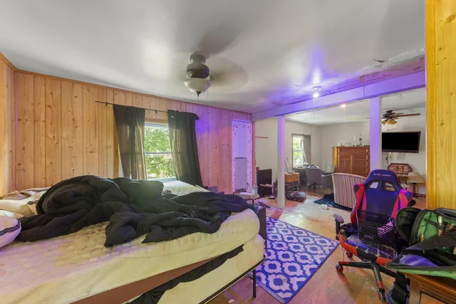 a living room with furniture fireplace and flat screen tv