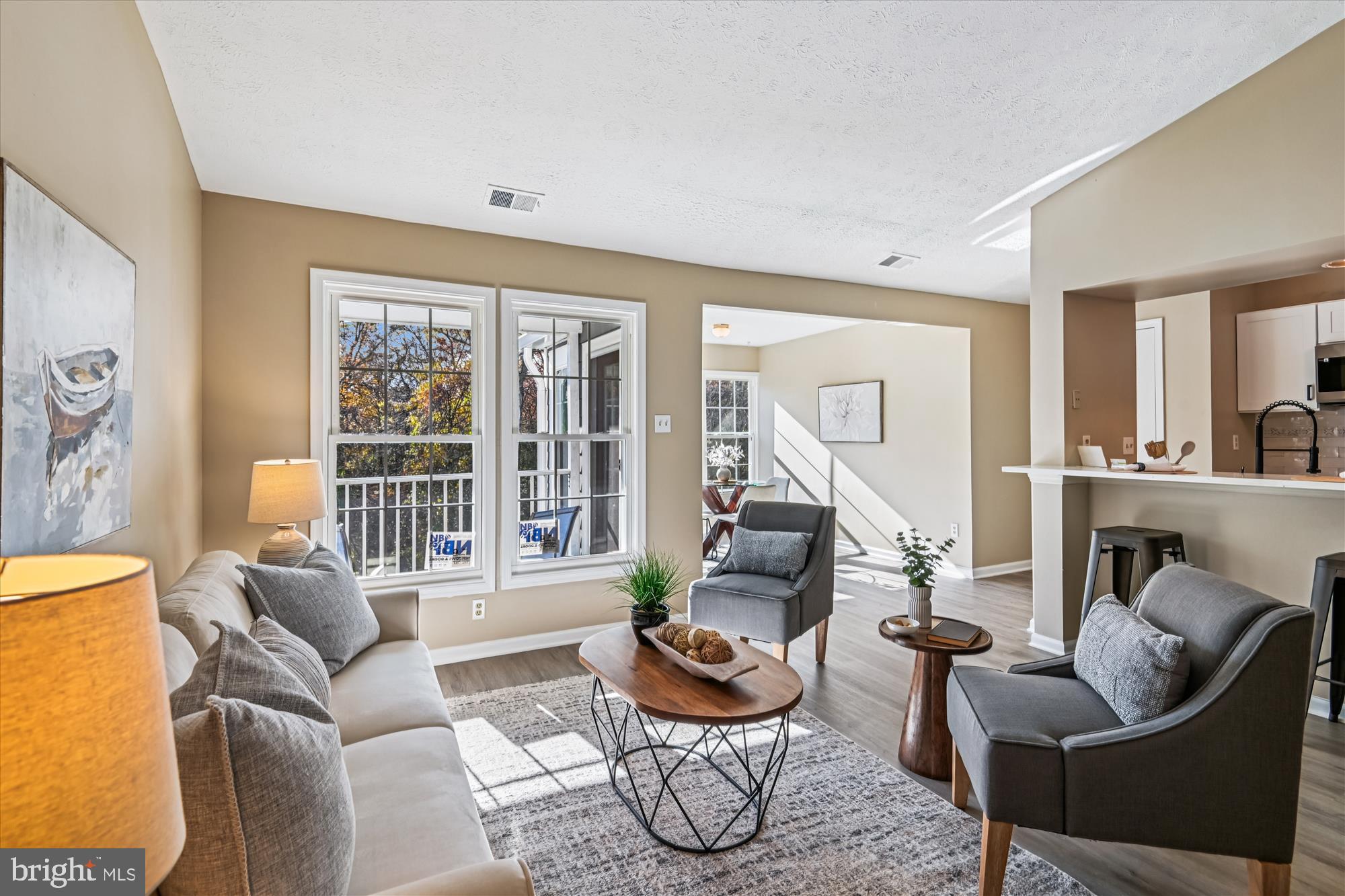 717 Deering Road, Unit 5L Pasadena, MD 21122 - Photo 12 of 29 a living room with furniture and a potted plant