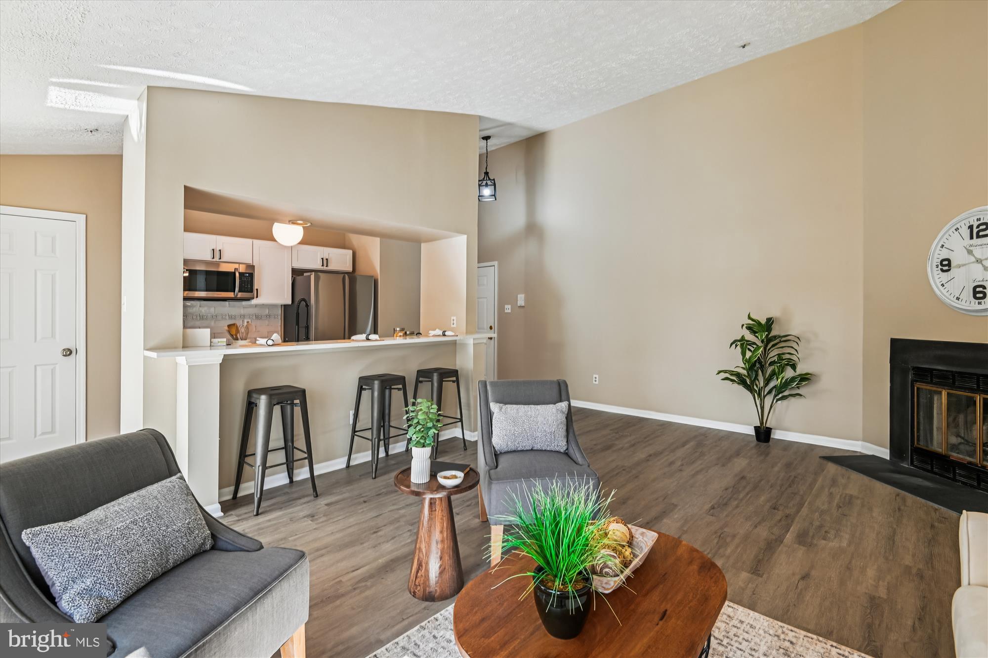 717 Deering Road, Unit 5L Pasadena, MD 21122 - Photo 13 of 29 a living room with furniture fireplace and dining table
