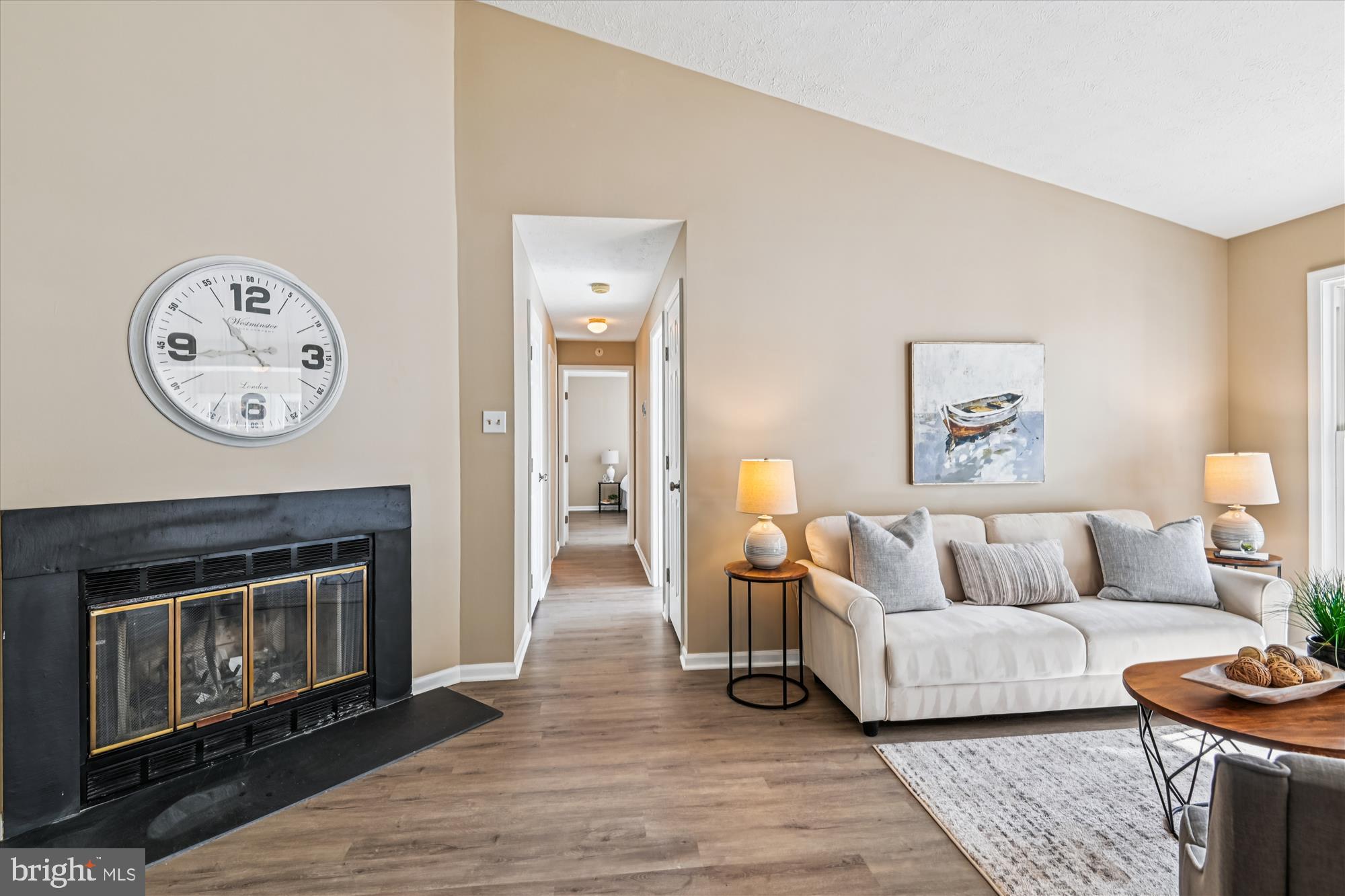 717 Deering Road, Unit 5L Pasadena, MD 21122 - Photo 14 of 29 a living room with furniture and a fireplace