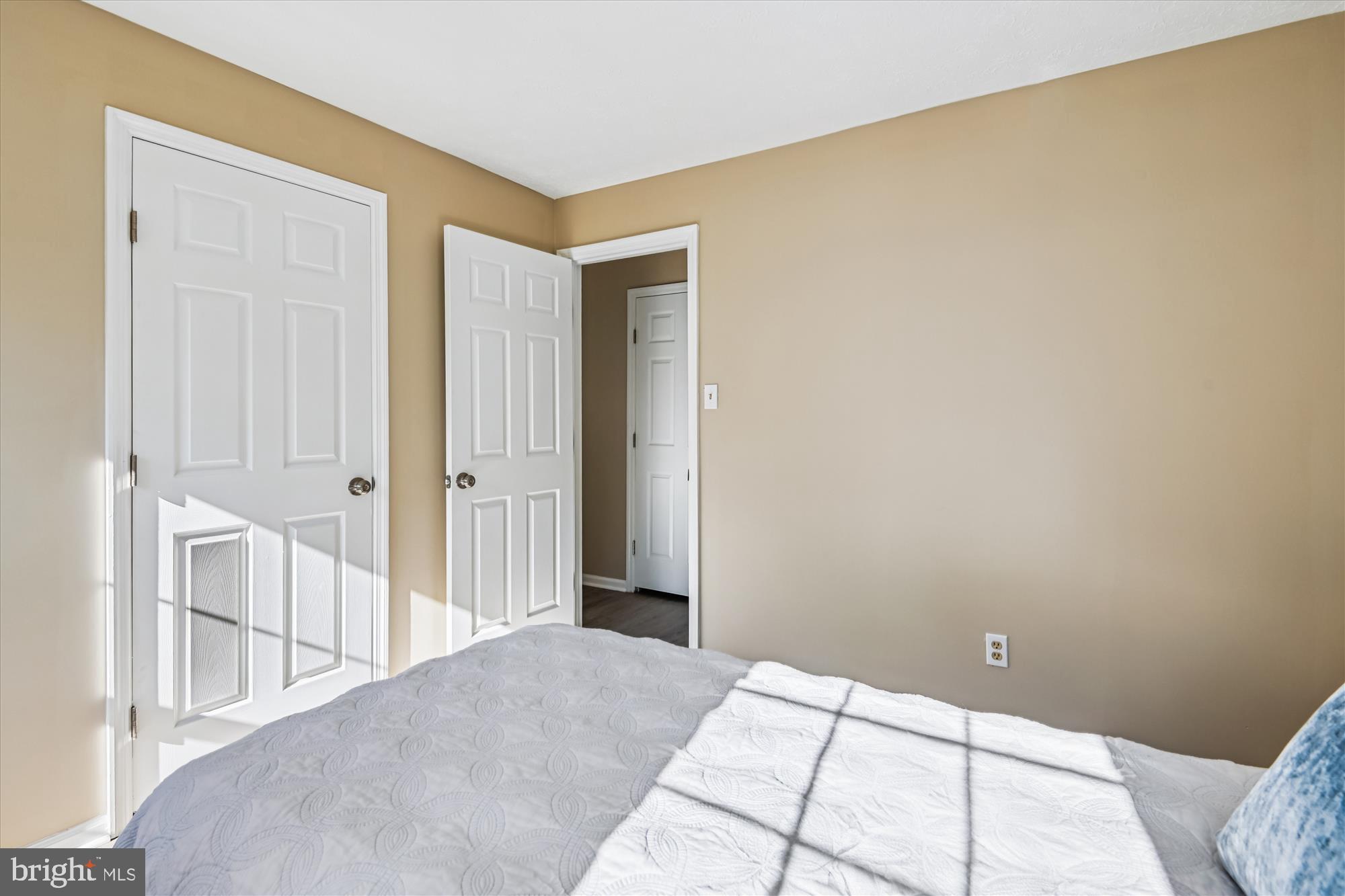 717 Deering Road, Unit 5L Pasadena, MD 21122 - Photo 18 of 29 a bedroom with a bed and a table in it