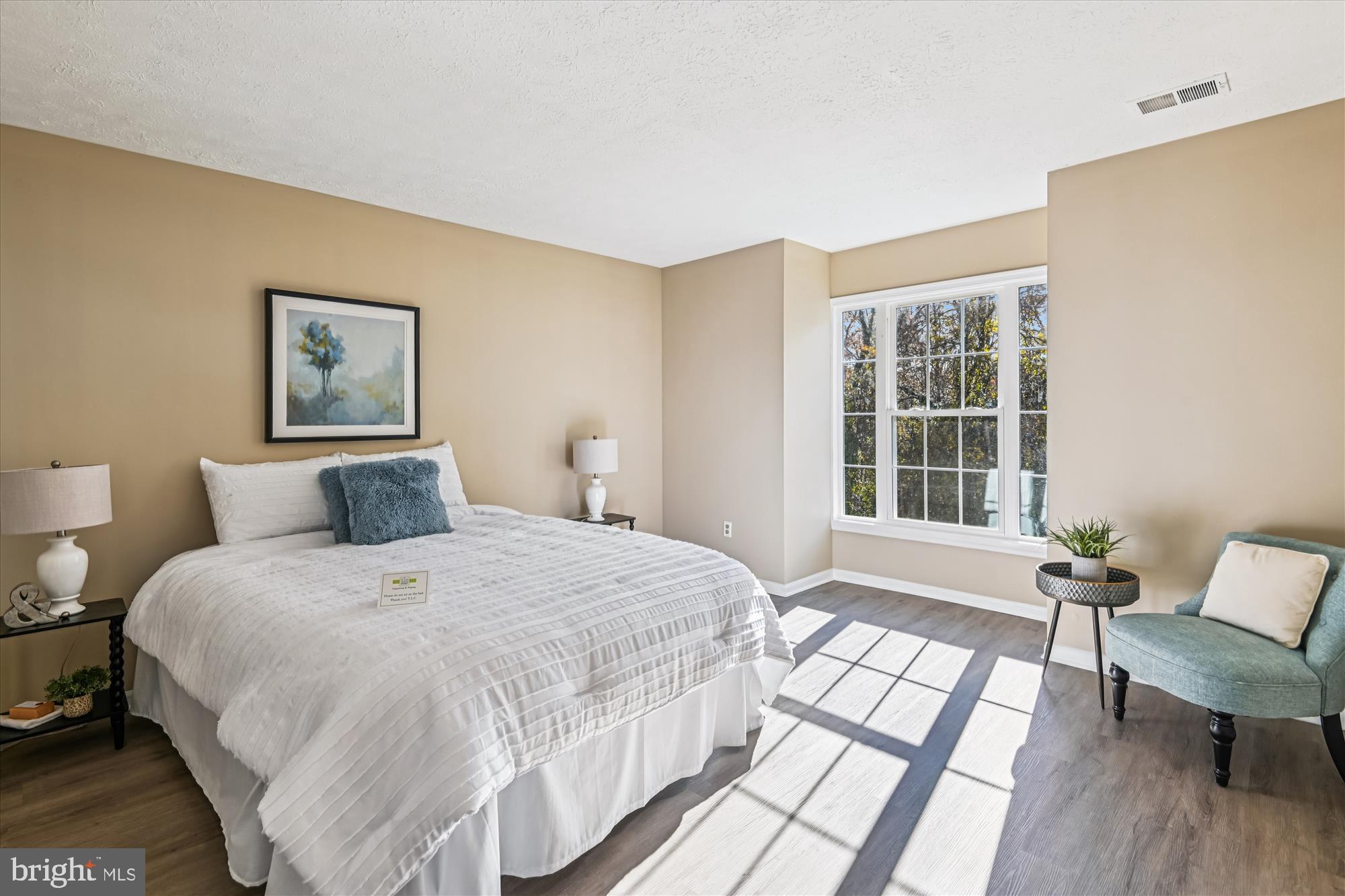 717 Deering Road, Unit 5L Pasadena, MD 21122 - Photo 6 of 29 a bedroom with a bed and a chair