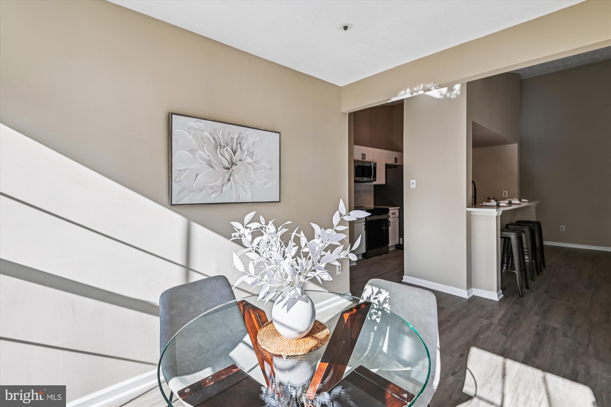 717 Deering Road, Unit 5L Pasadena, MD 21122 - Photo 10 of 29 a dining room with furniture and wooden floor