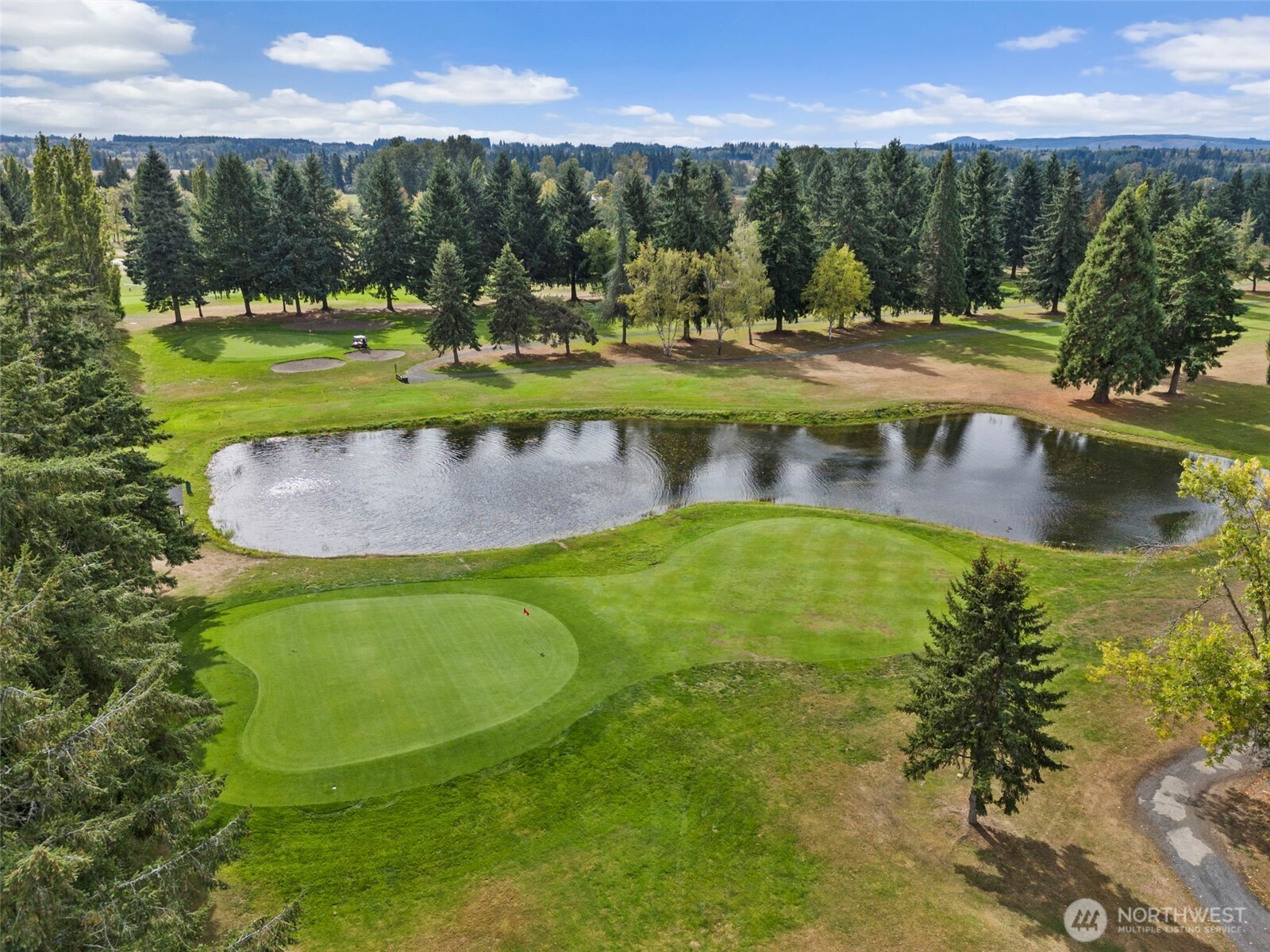 112 Village Way Drive Chehalis, WA 98532 - Photo 38 of 40 a view of a swimming pool with a yard and outdoor seating