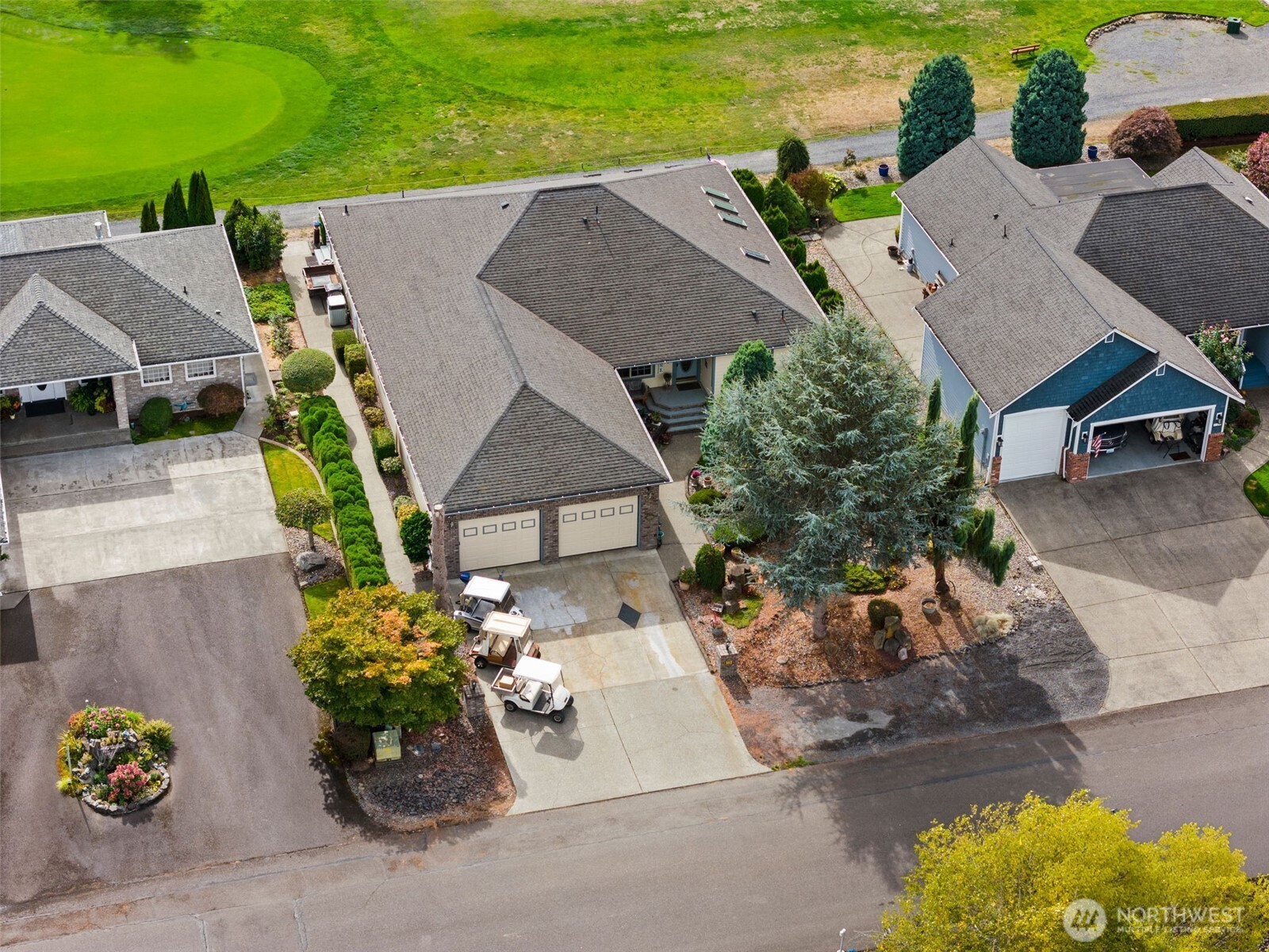 112 Village Way Drive Chehalis, WA 98532 - Photo 6 of 40 an aerial view of a house with a garden and mountain view in back