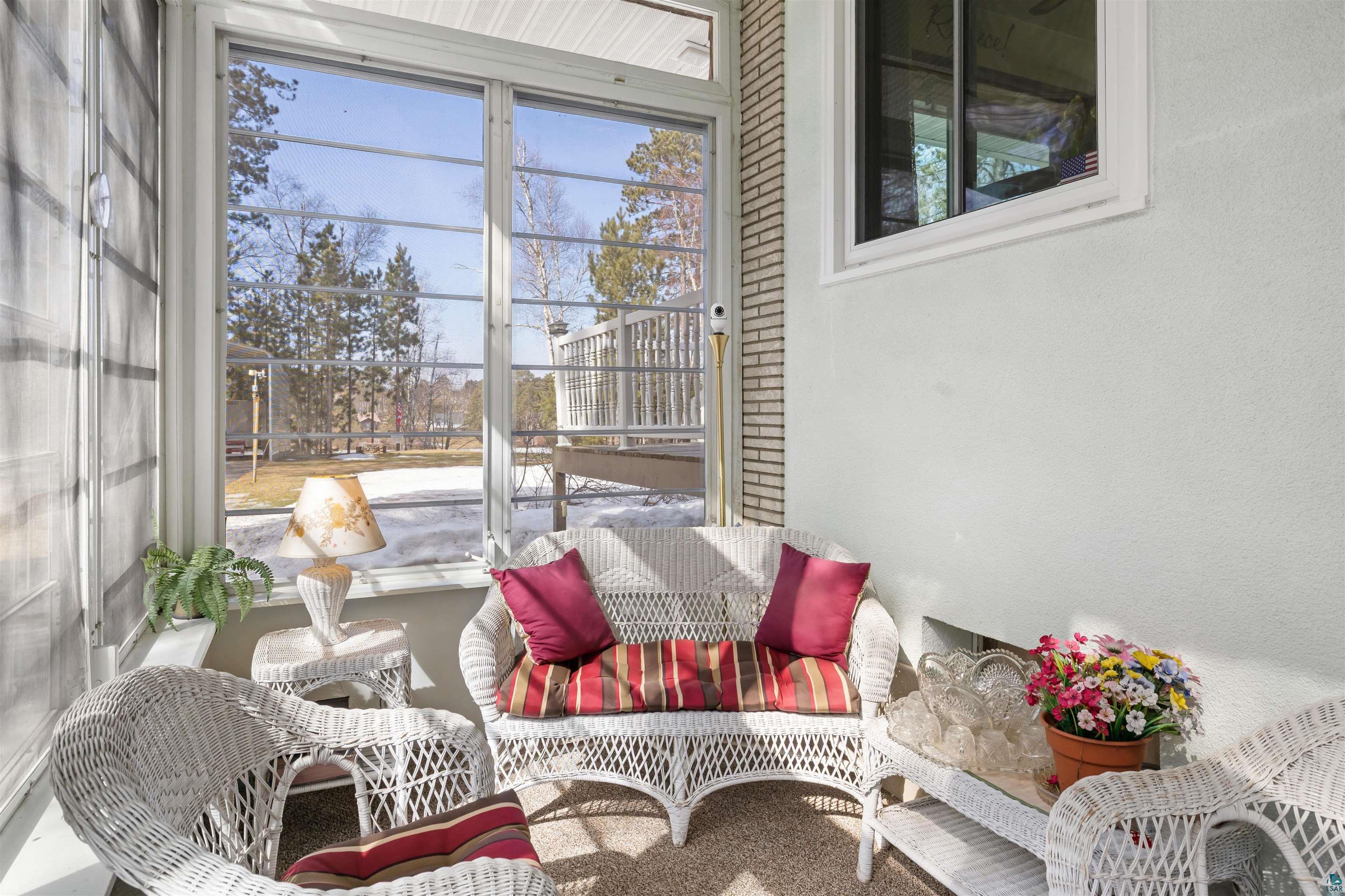 3975 Long Lake Shores Road Eveleth, MN 55734 - Photo 13 of 84 Sunroom / solarium featuring plenty of natural light and carpet