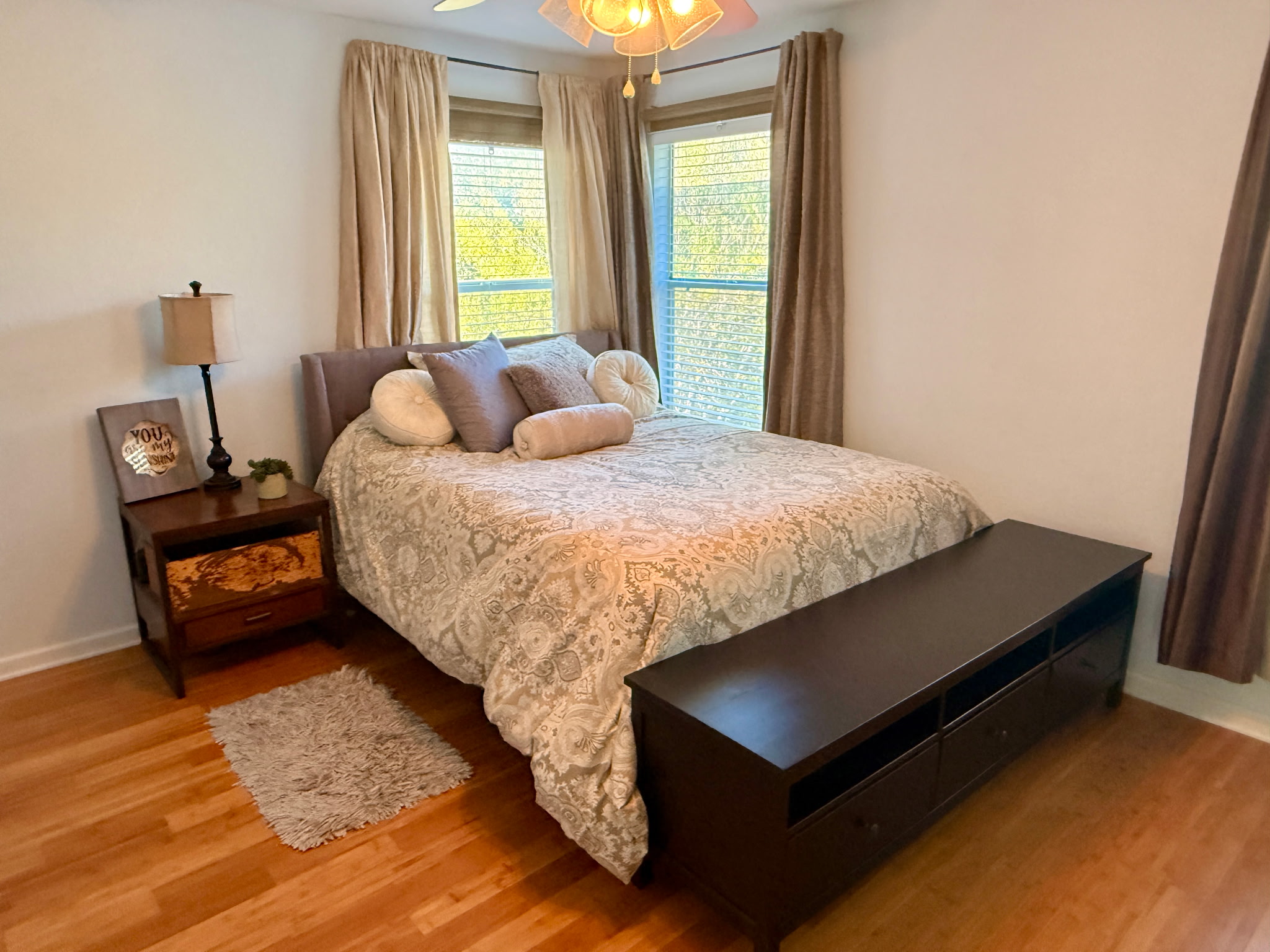 904 Double File Cove Round Rock, TX 78665 - Photo 18 of 25 Warm wood flooring and classic window trims anchor this inviting bedroom space.