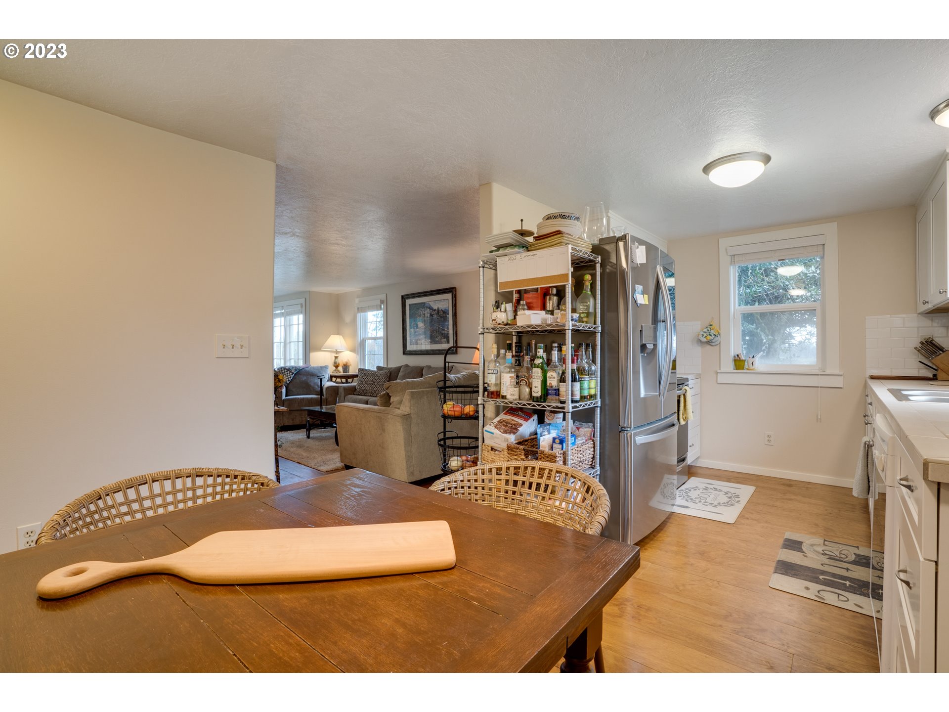360 Southeast Edwards Drive Dundee, OR 97115 - Photo 11 of 31 a living room with furniture a flat screen tv and a wooden floor