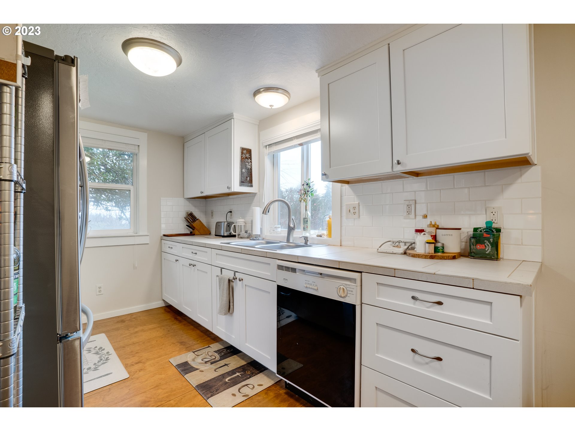 360 Southeast Edwards Drive Dundee, OR 97115 - Photo 12 of 31 a kitchen with a cabinets window and appliances