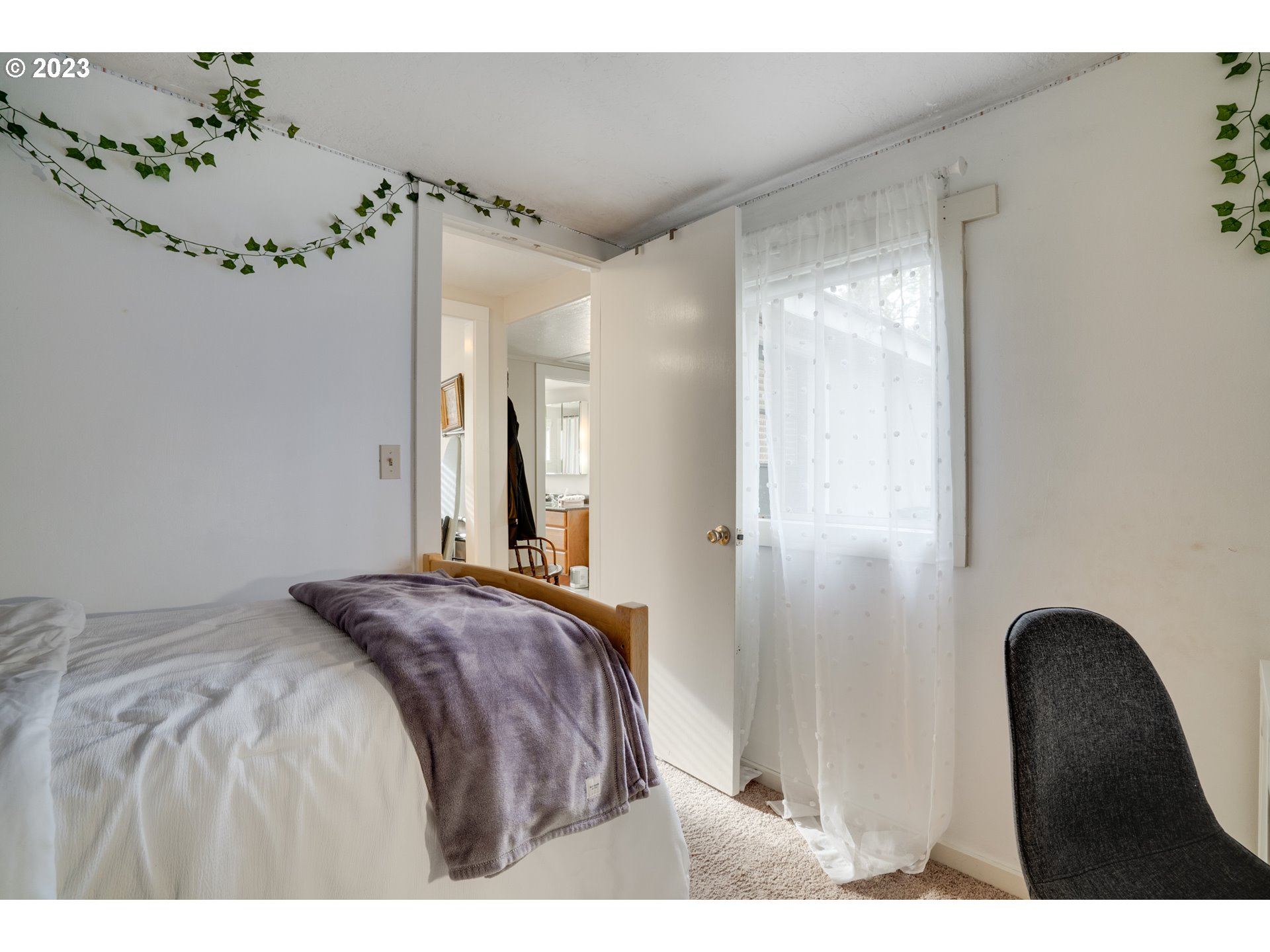 360 Southeast Edwards Drive Dundee, OR 97115 - Photo 15 of 31 a bedroom with a bed and a chair