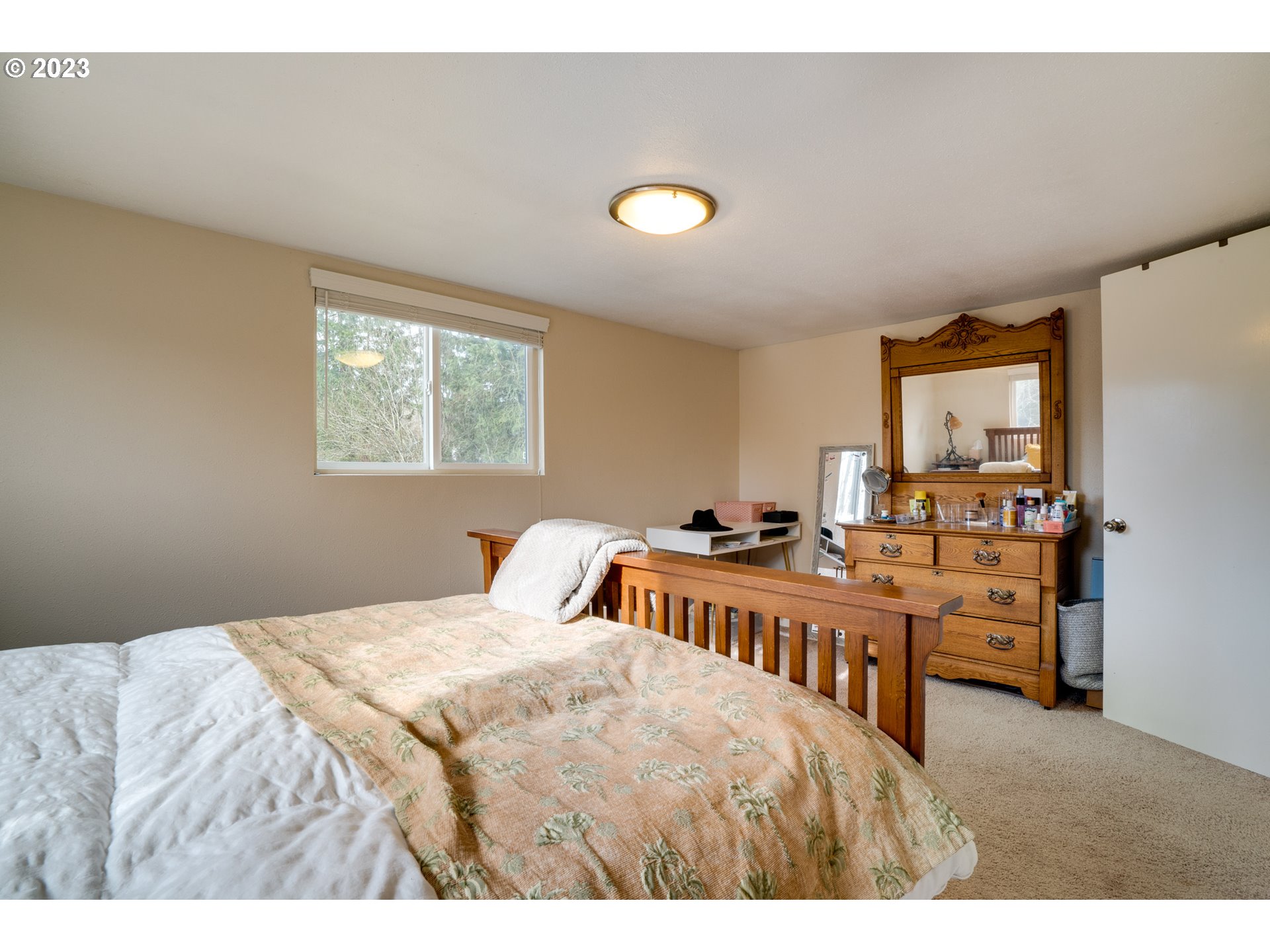 360 Southeast Edwards Drive Dundee, OR 97115 - Photo 19 of 31 a bedroom with a bed and a table