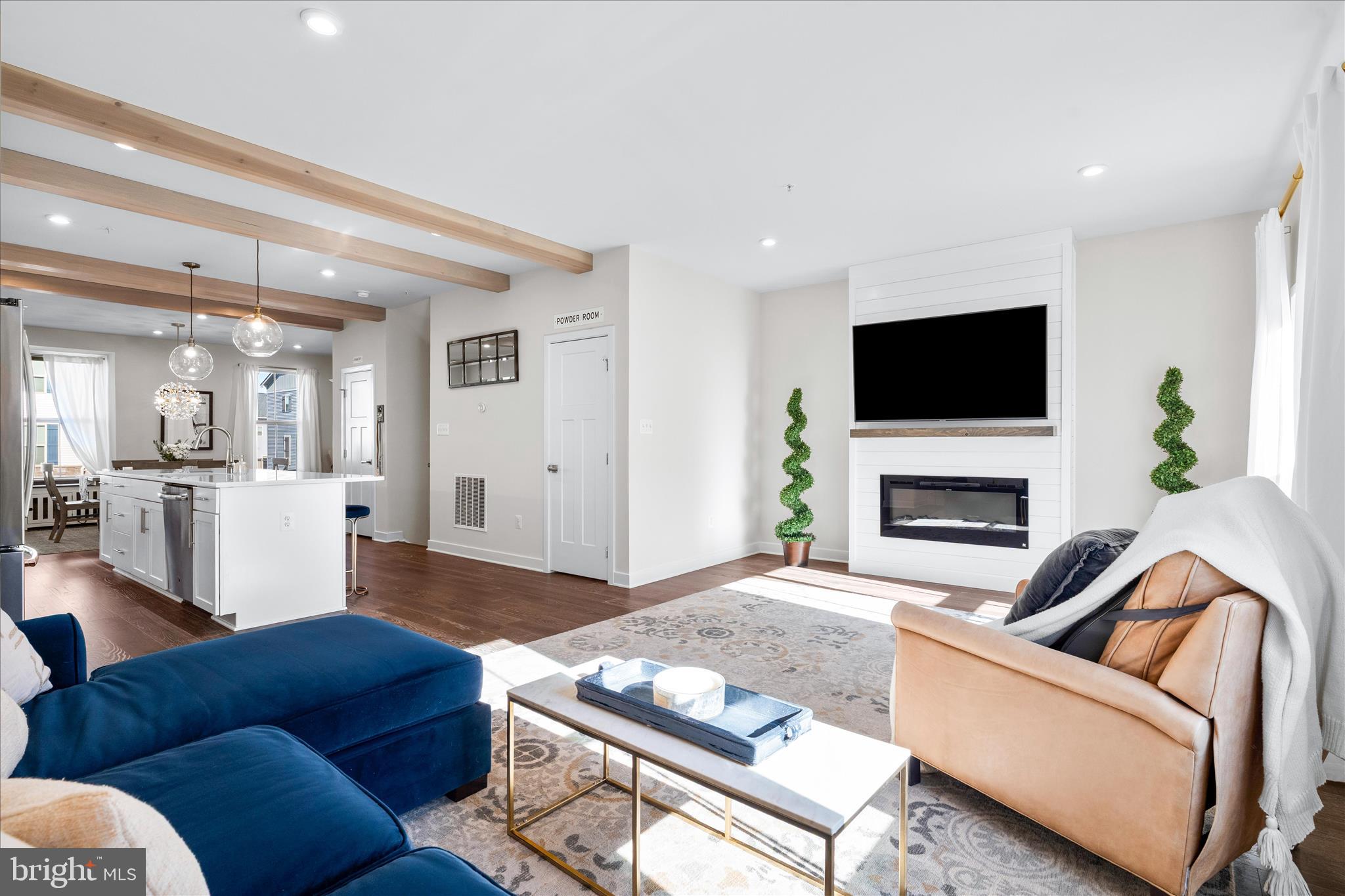 10327 Quillback Street New Market, MD 21774 - Photo 12 of 50 a living room with furniture a flat screen tv and a fireplace