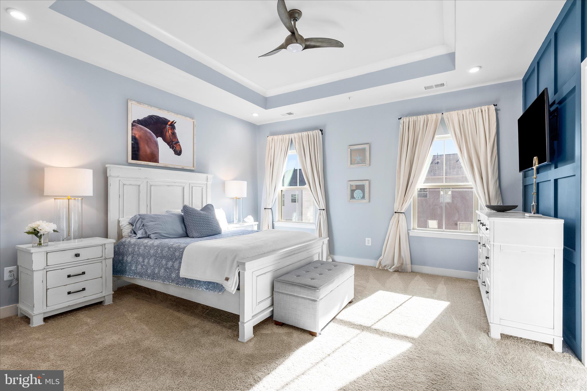 10327 Quillback Street New Market, MD 21774 - Photo 21 of 50 a bedroom with a bed and a flat screen tv