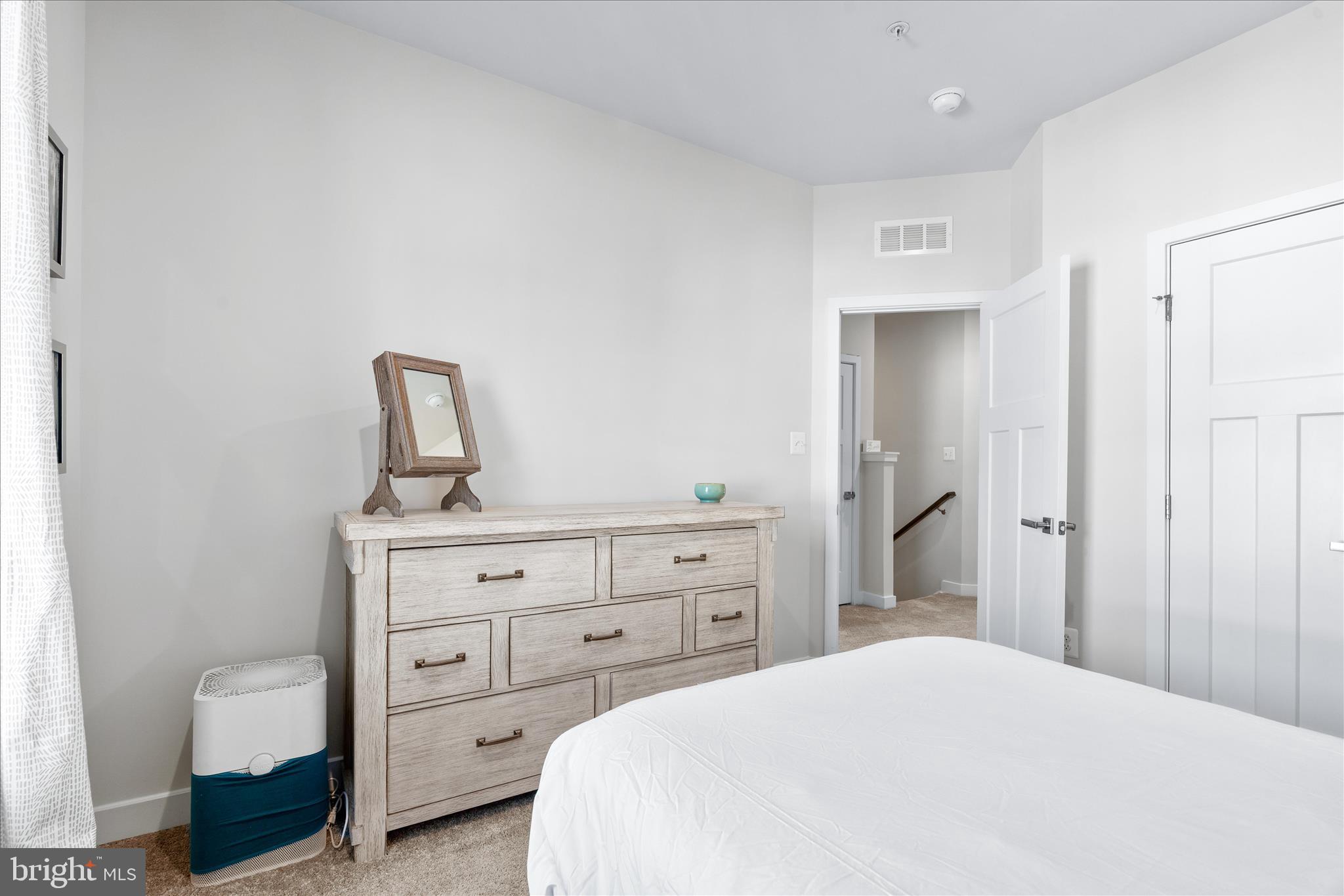 10327 Quillback Street New Market, MD 21774 - Photo 27 of 50 a bedroom with a bed and a dresser