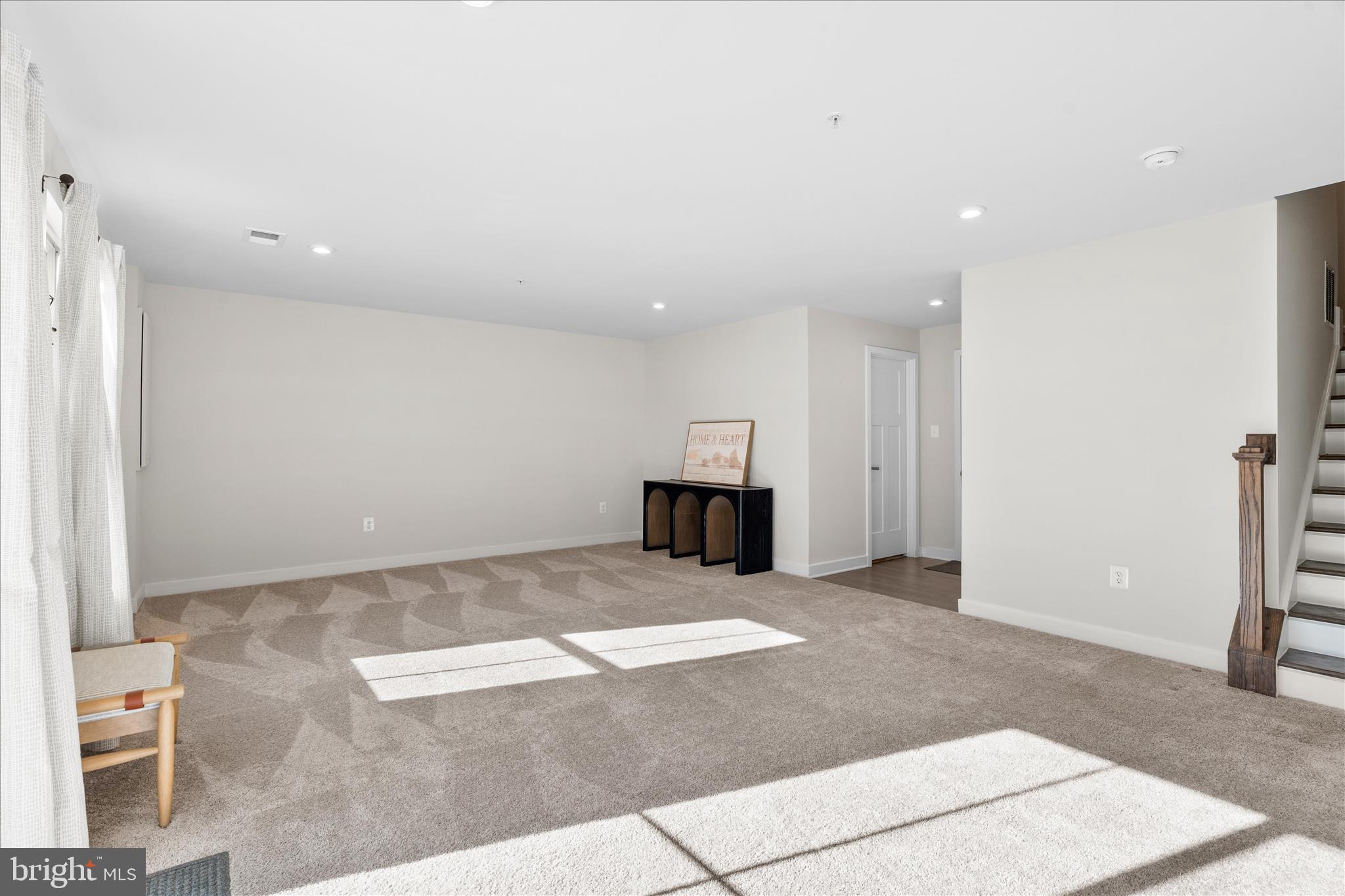 10327 Quillback Street New Market, MD 21774 - Photo 32 of 50 a view of an empty room with a fireplace