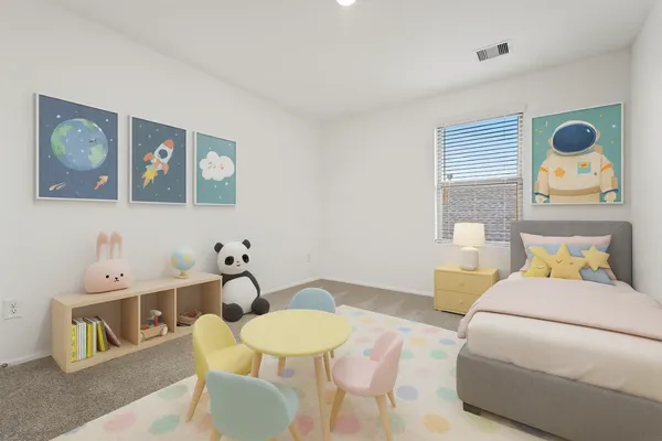 a bedroom with a bed and a table in it