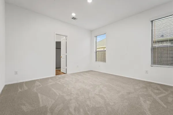 an empty room with windows