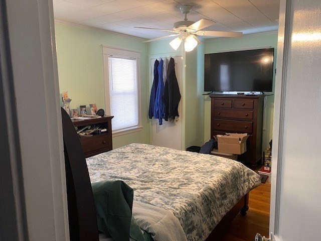 70 Prospect Street, Unit 70 Watertown, MA 02472 - Photo 6 of 9 a bedroom with a bed and a bathroom