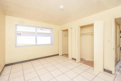 a view of an empty room and window