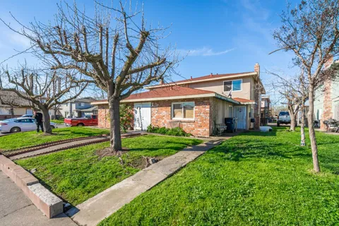 a front view of a house with a yard