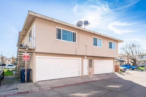 a front view of a house with a garage