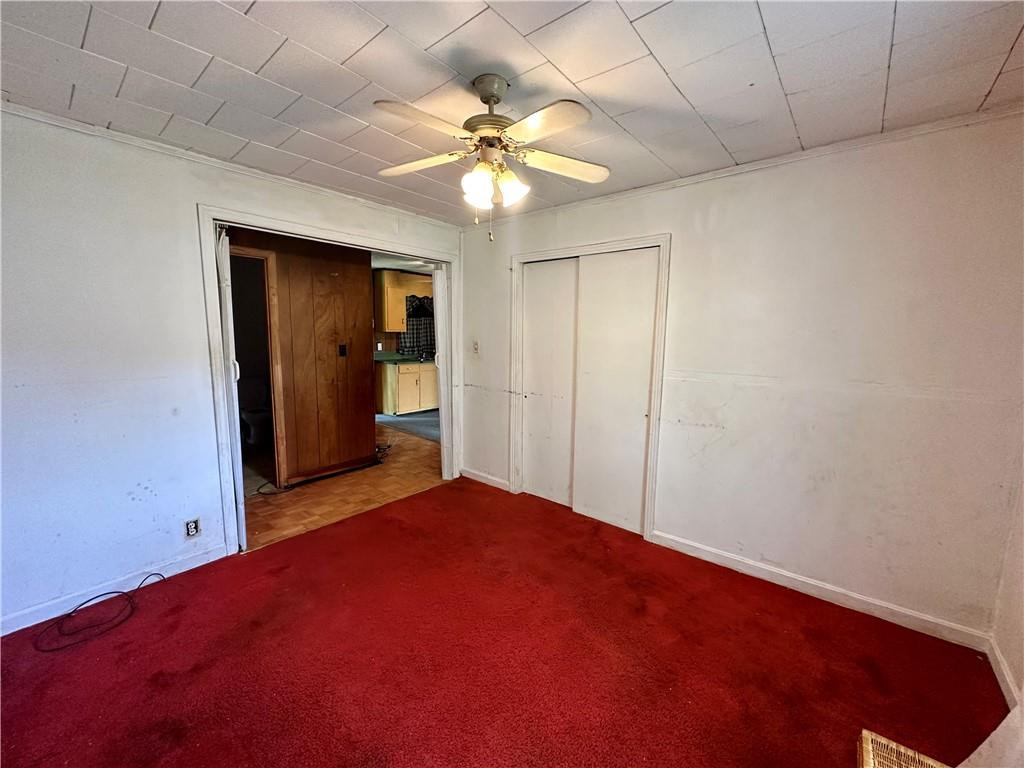 5545 Woodsdale Road Roxboro, NC 27574 - Photo 15 of 24 an empty room with closet and a chandelier fan