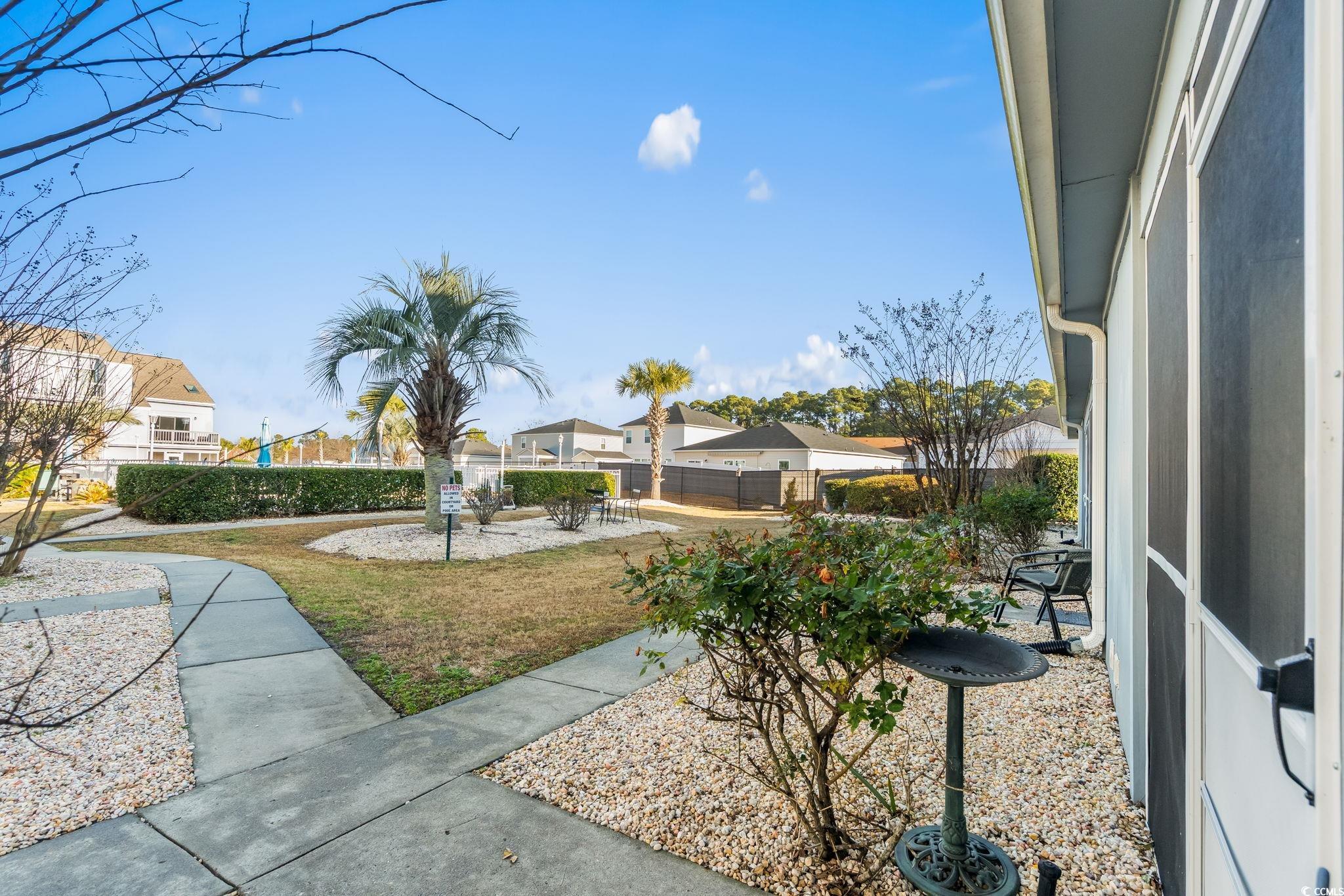 1890 Colony Drive, Unit 16I Myrtle Beach, SC 29575 - Photo 15 of 35 View of yard featuring a residential view