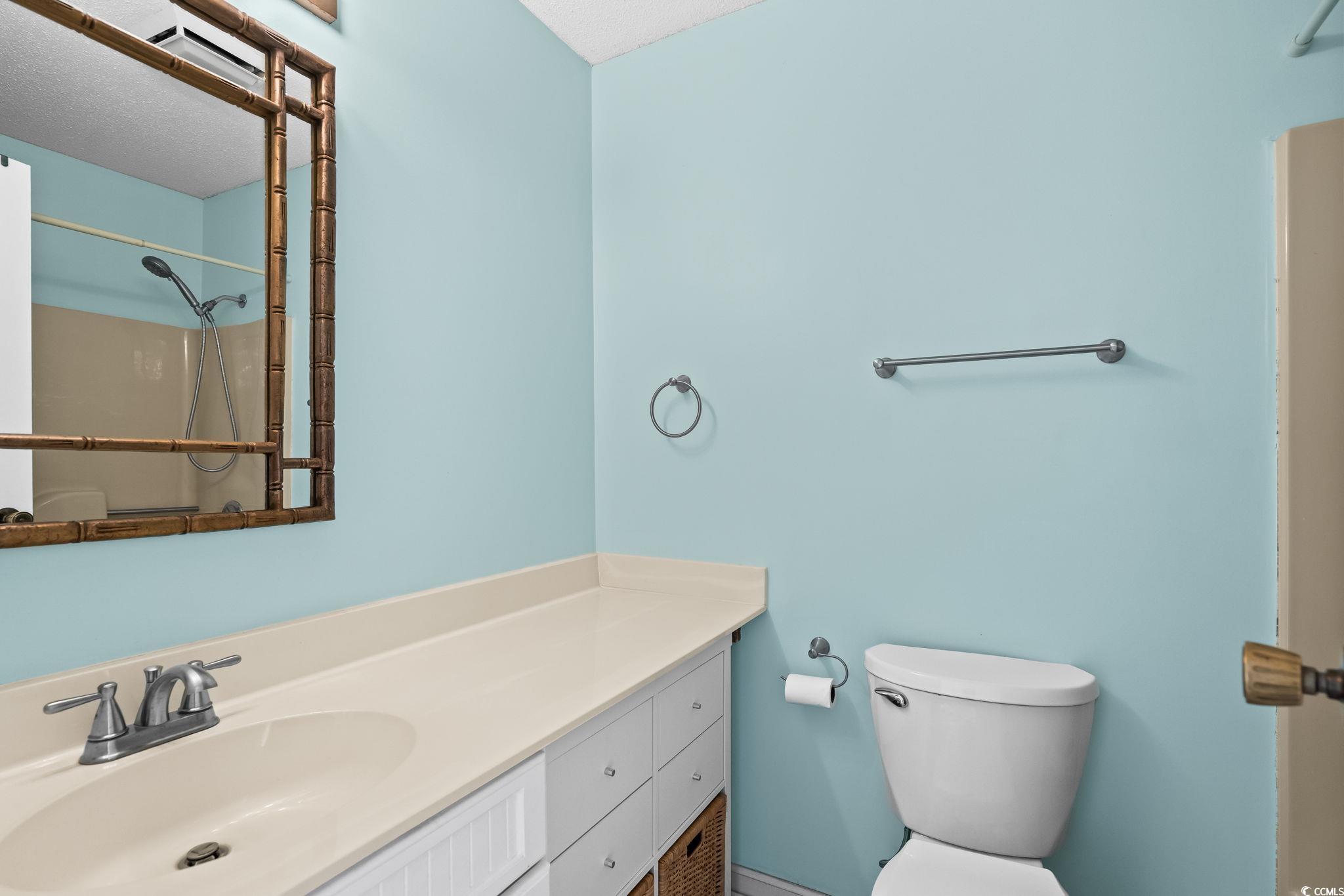 1890 Colony Drive, Unit 16I Myrtle Beach, SC 29575 - Photo 2 of 35 Full bath with a shower with shower curtain and vanity