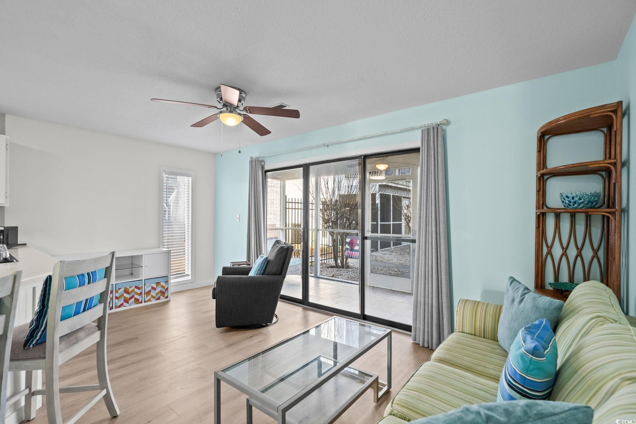 1890 Colony Drive, Unit 16I Myrtle Beach, SC 29575 - Photo 4 of 35 Living room featuring wood finished floors and ceiling fan