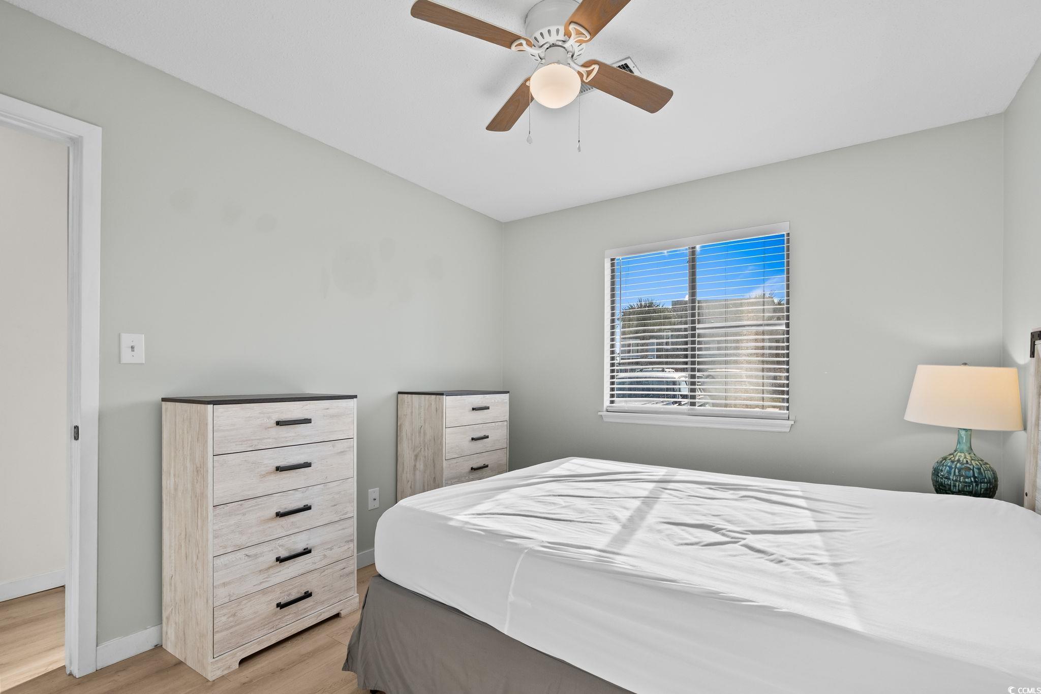 1890 Colony Drive, Unit 16I Myrtle Beach, SC 29575 - Photo 5 of 35 Bedroom featuring wood finished floors and a ceiling fan