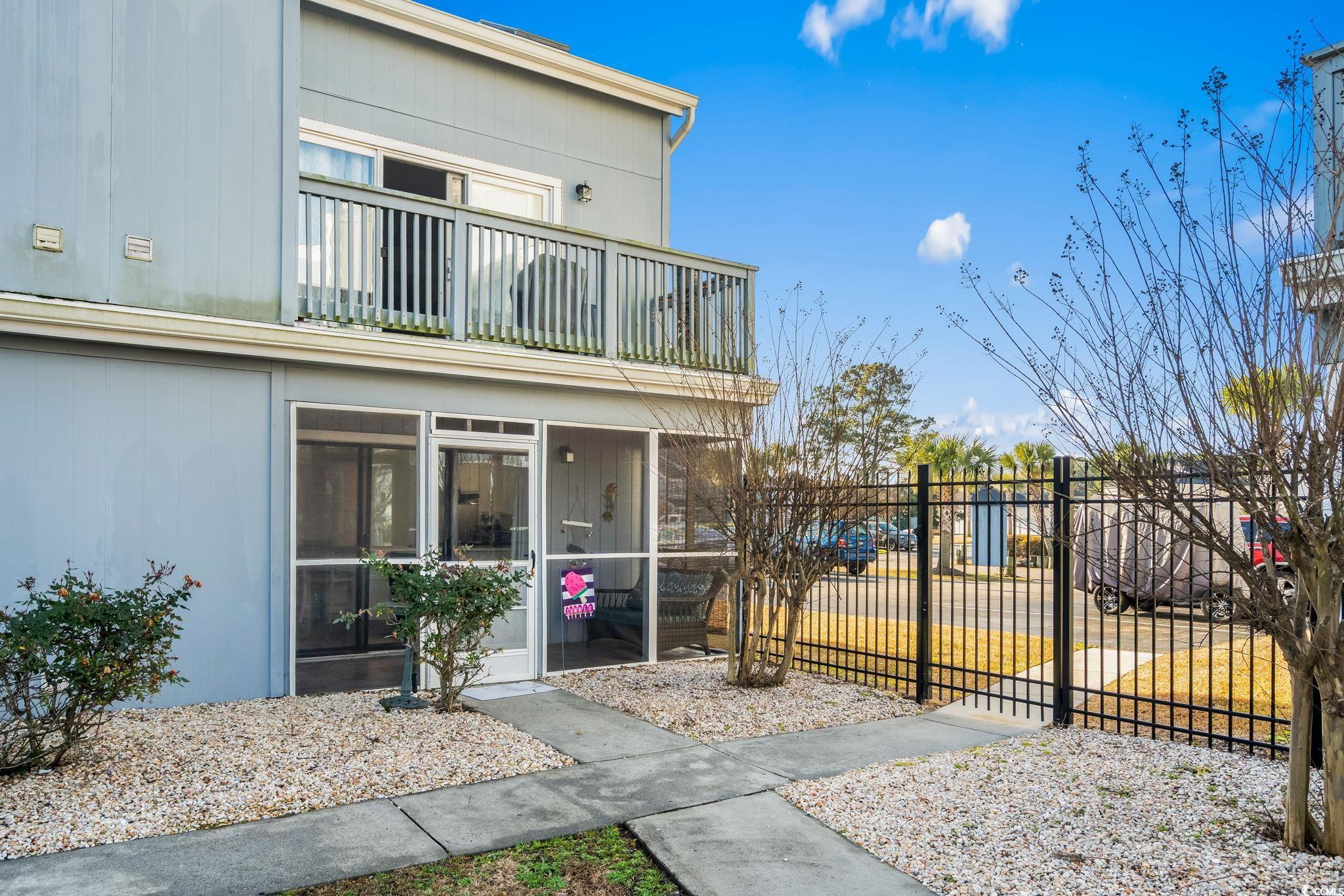 1890 Colony Drive, Unit 16I Myrtle Beach, SC 29575 - Photo 10 of 35 View of property exterior with a sunroom and a balcony