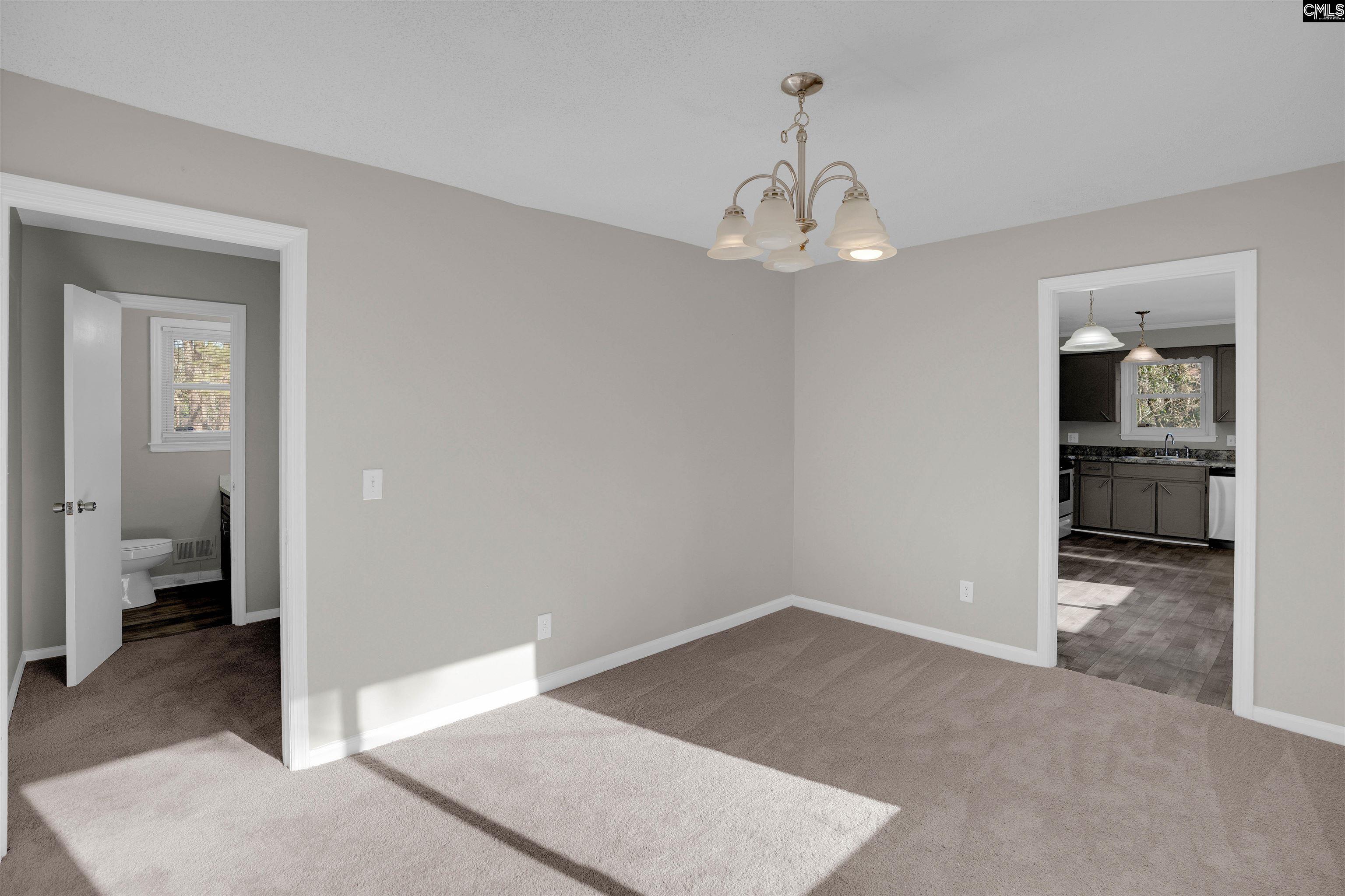 2620 Pleasant Ridge Drive Columbia, SC 29209 - Photo 14 of 37 wooden floor in an empty room and a bathroom