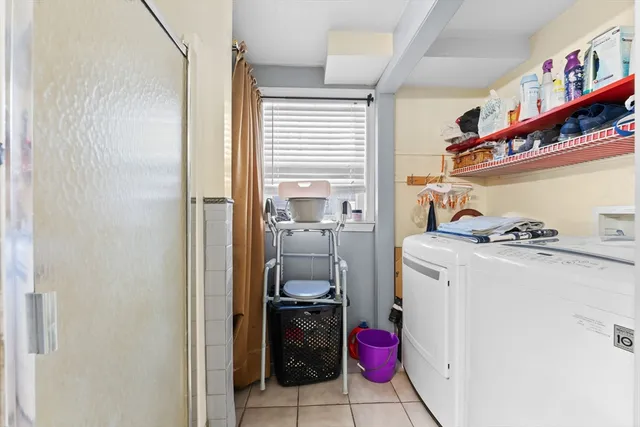 a utility room with dryer and washer