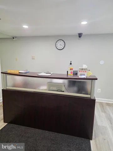 a kitchen with kitchen island sink and cabinets