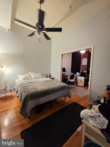 a bedroom with a bed and a flat tv screen