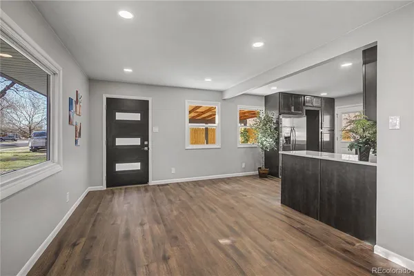 a kitchen with stainless steel appliances granite countertop wooden cabinets a stove top oven a sink and dishwasher