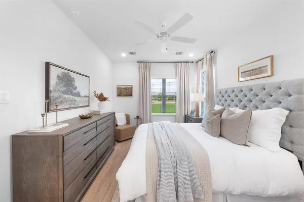 a bedroom with a large bed and a window