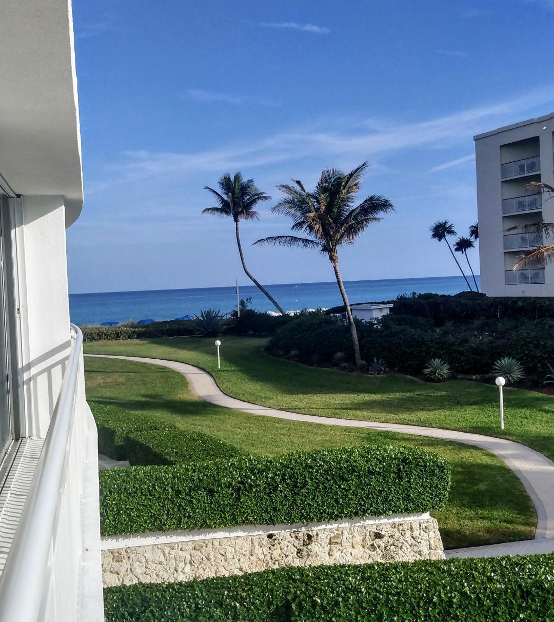 2780 South Ocean Boulevard, Unit 207 Palm Beach, FL 33480 - Photo 1 of 8 a view of a golf course with a lake