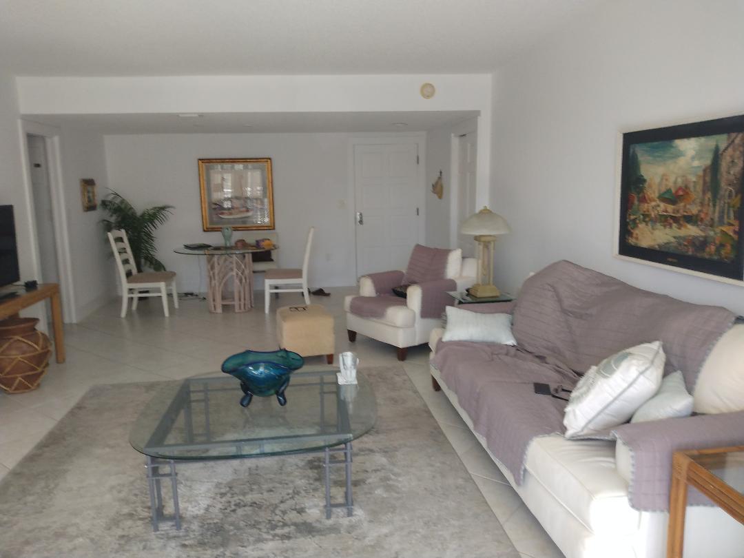 2780 South Ocean Boulevard, Unit 207 Palm Beach, FL 33480 - Photo 4 of 8 a living room with furniture and a potted plant