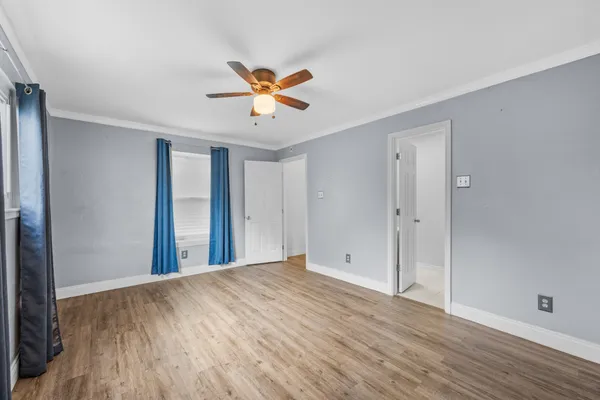 a view of an empty room with a window