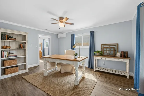 a view of livingroom with furniture and windows