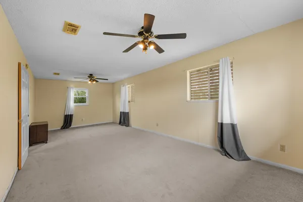 an aerial view of residential building and lake
