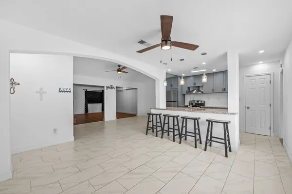 a kitchen with stainless steel appliances a refrigerator and a sink