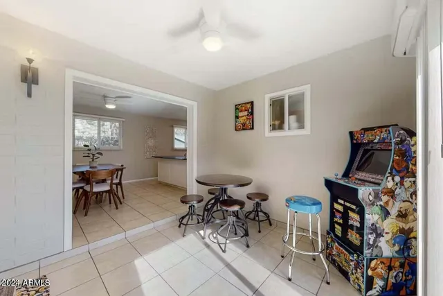 a view of a livingroom with furniture and a window