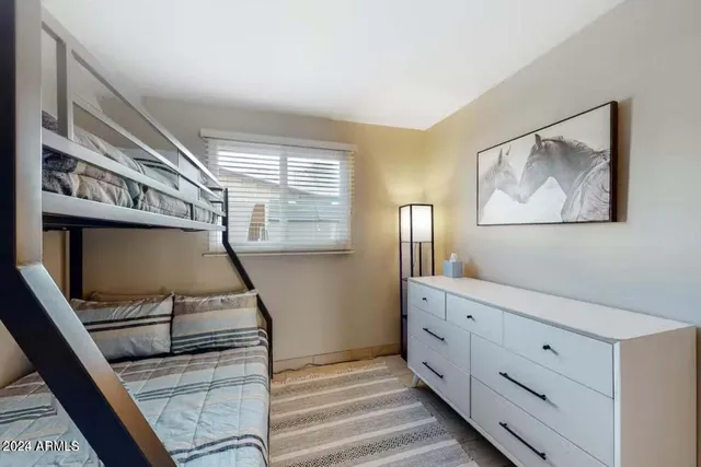 a hallway with cabinets and wooden floor