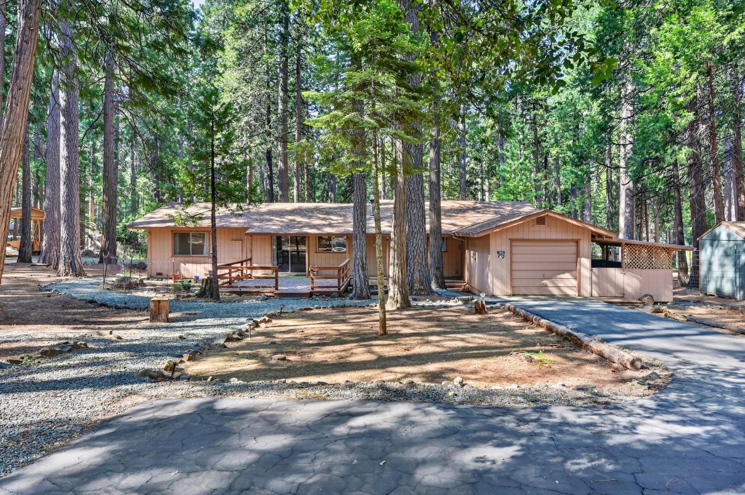 20191 Kit Court Volcano, CA 95689 - Photo 2 of 54 a view of a house with a yard and large tree