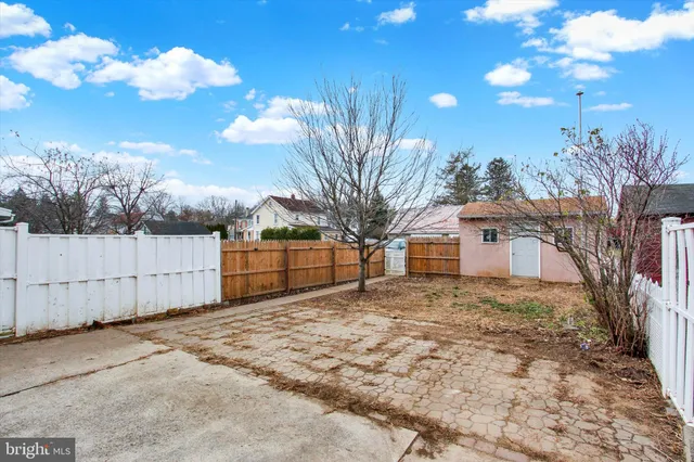 a view of a house with a yard and garage