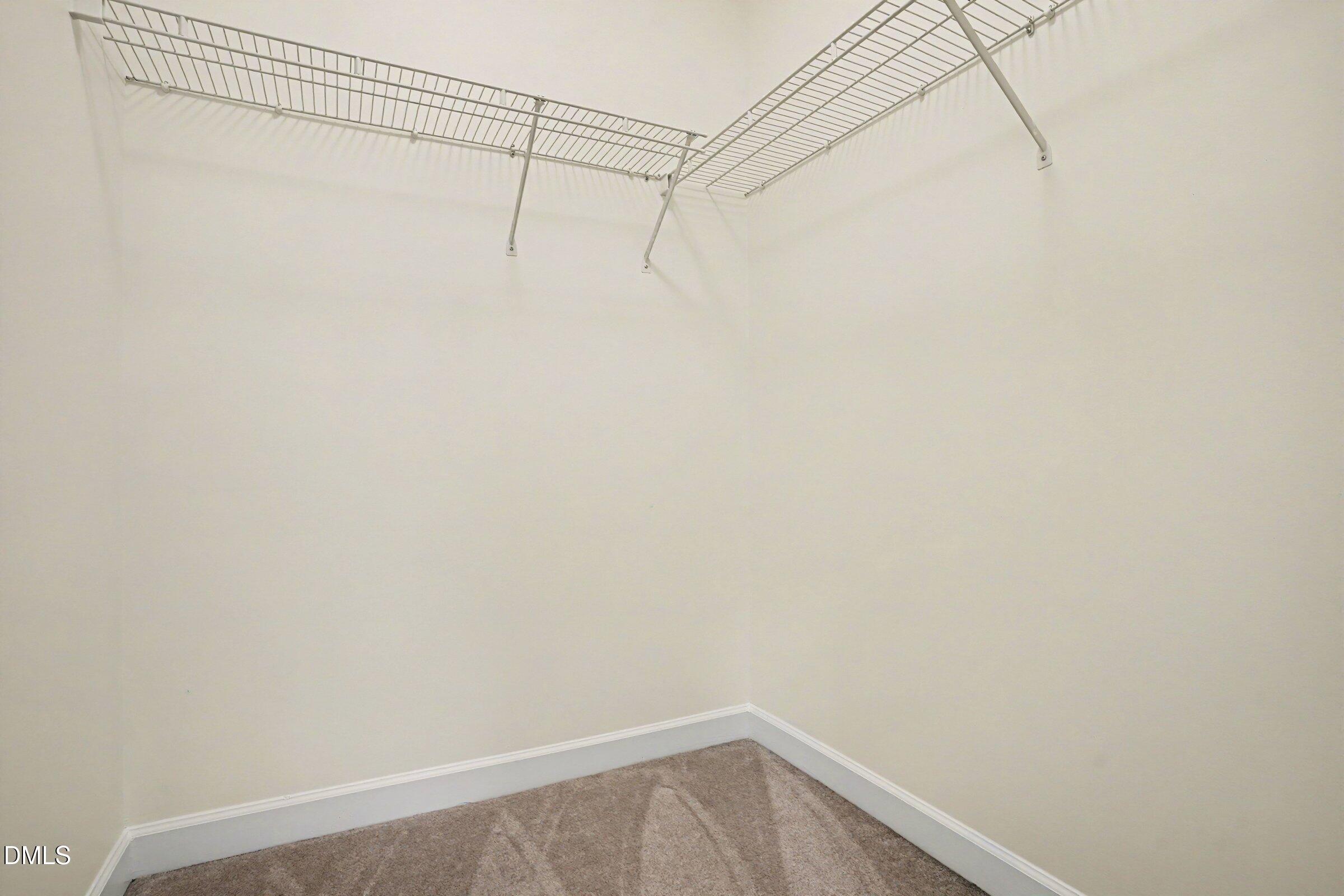 2651 Mellowfield Drive, Unit 203 Raleigh, NC 27604 - Photo 16 of 32 a view of a room with racks on the wall