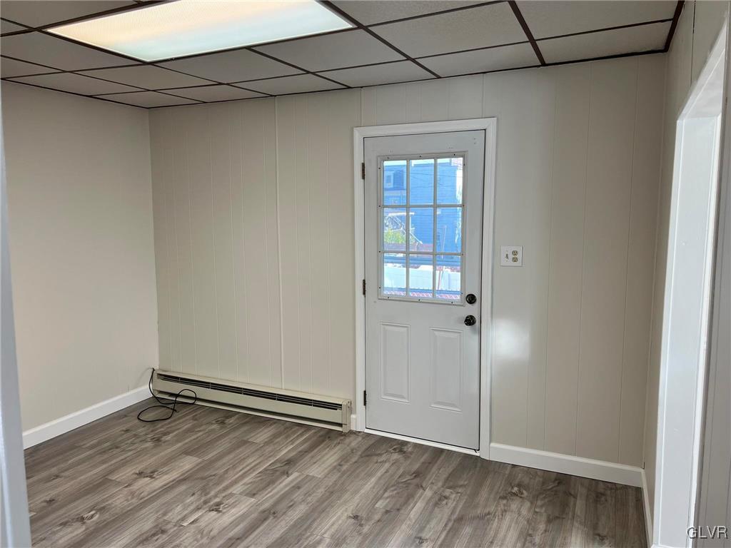 121 South 3rd Street Lehighton Borough, PA 18235 - Photo 11 of 18 a view of an empty room with wooden floor and a window