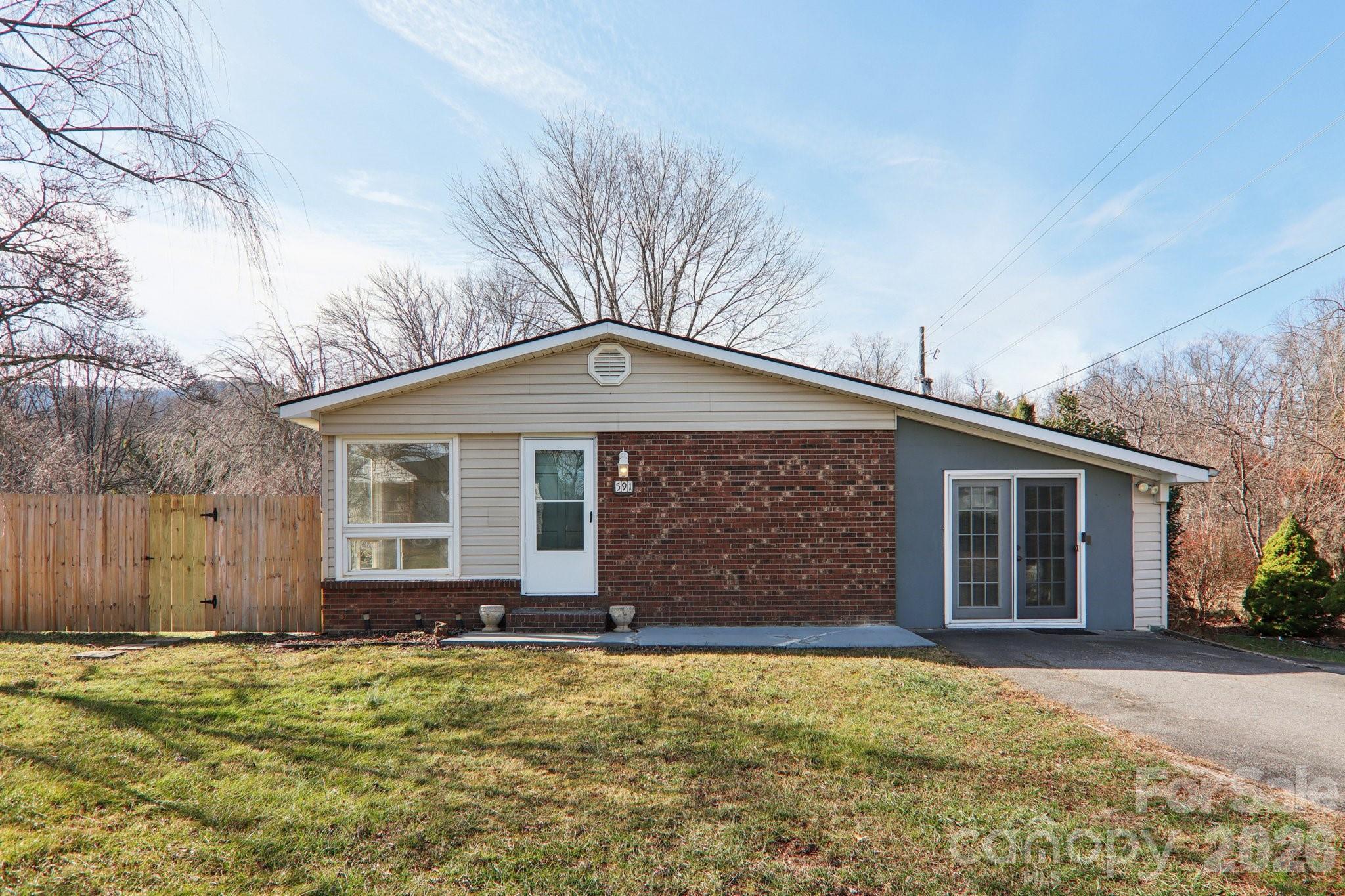 front view of a house with a yard